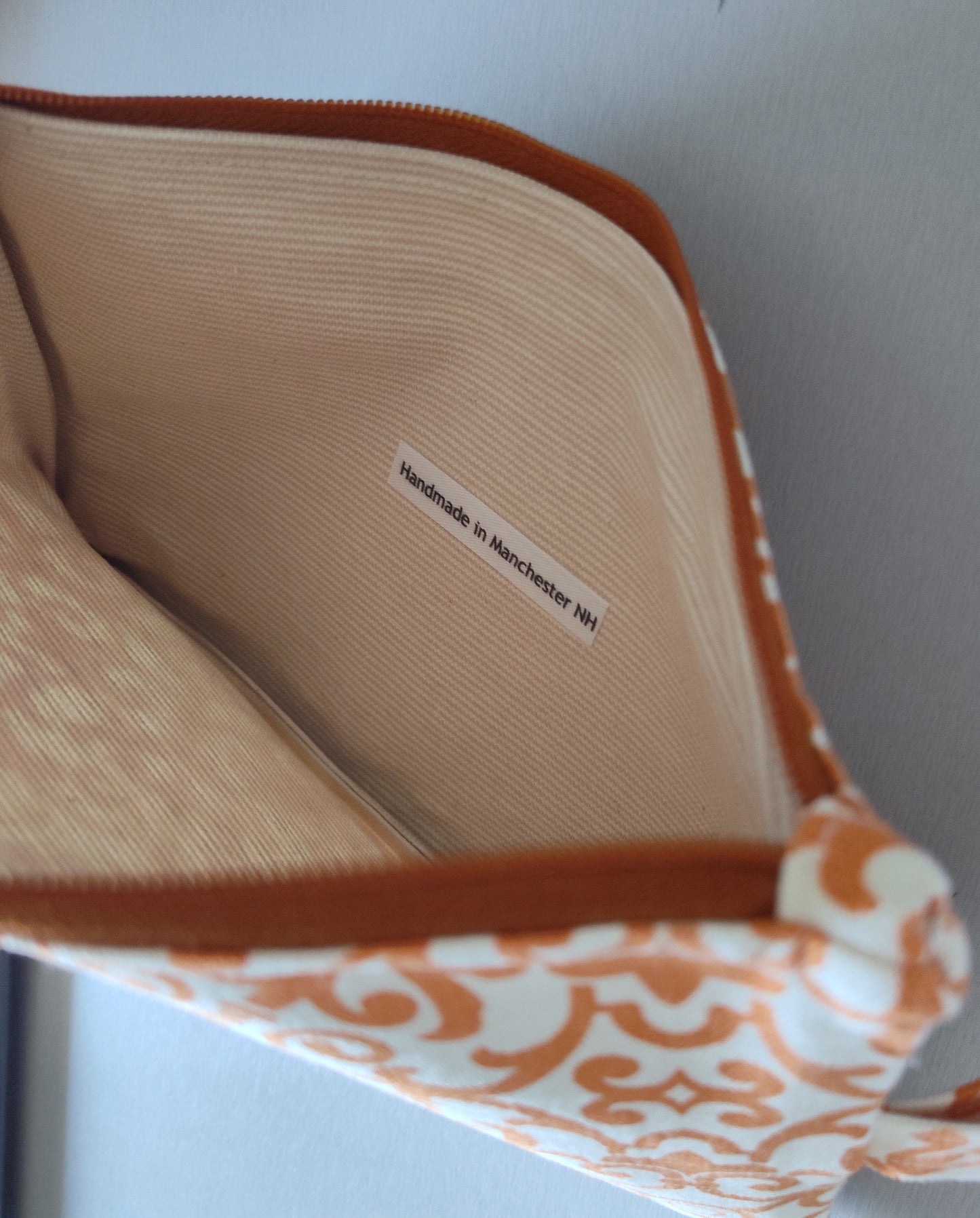 Orange-Paisley Geo Zippered Pouch Wristlet